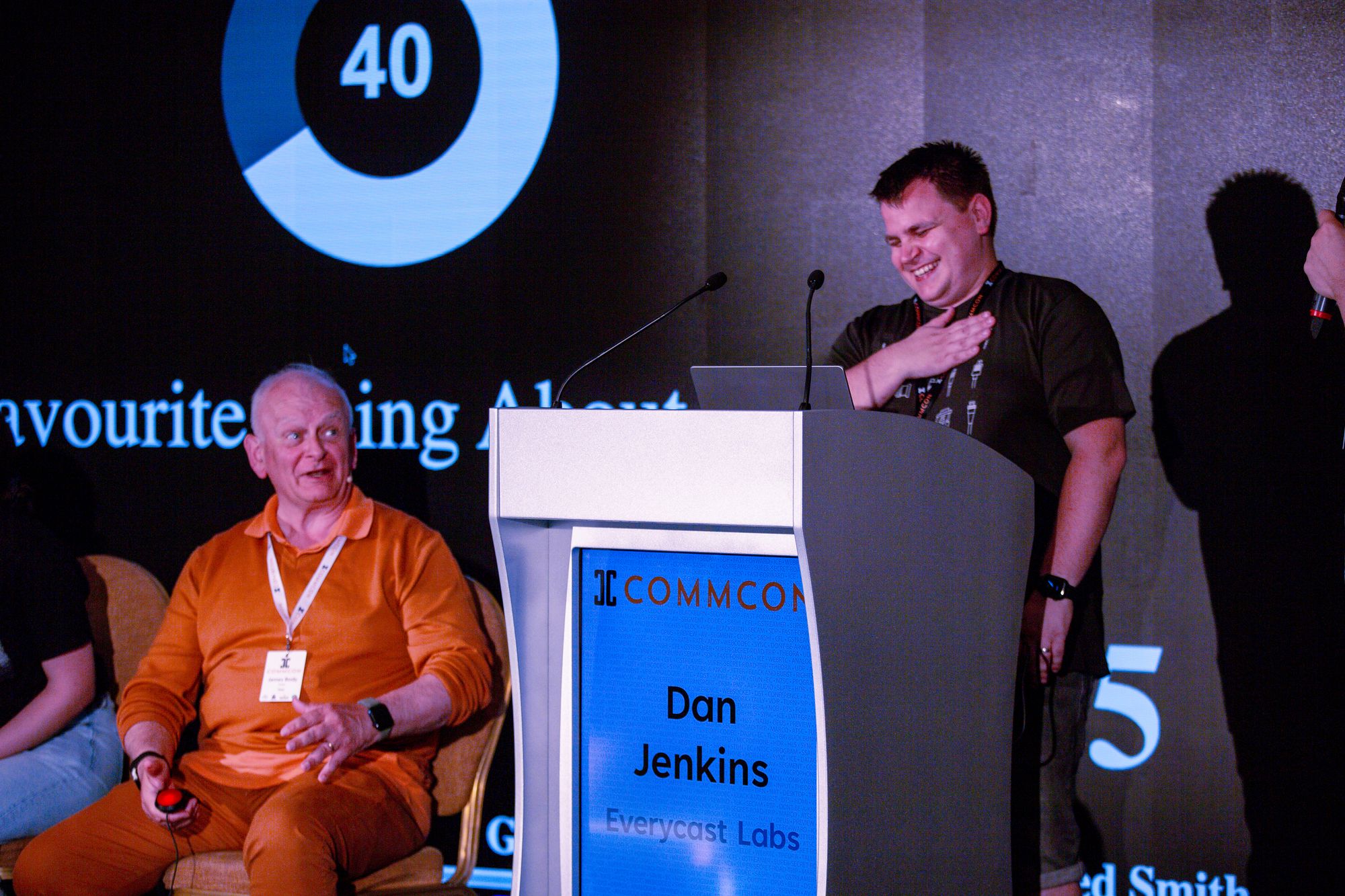 James Body and Dan having a laugh on stage at CommCon 2023 during 'Just an RTC Minute'
